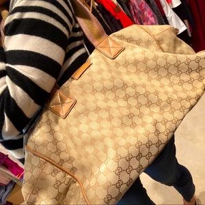 Gucci duffel bag. With visible wear.